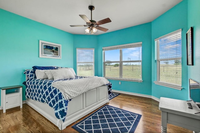 603 Watterson Rd Unit B, Bastrop, TX 78602 - bedroom with wood finished floors, baseboards, and a ceiling fan