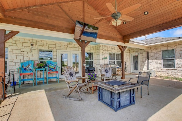 603 Watterson Rd Unit B, Bastrop, TX 78602 - view of patio with a fire pit, a ceiling fan, and french doors