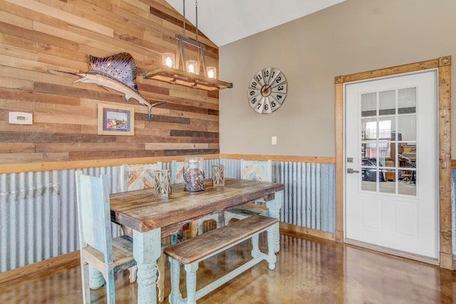 603 Watterson Rd Unit B, Bastrop, TX 78602 - dining area featuring vaulted ceiling and wood walls