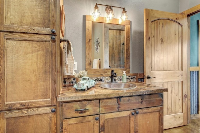 603 Watterson Rd Unit B, Bastrop, TX 78602 - bathroom with vanity and a textured wall