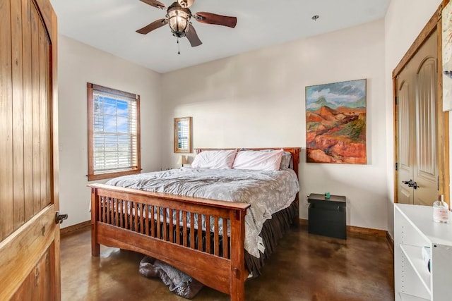 603 Watterson Rd Unit B, Bastrop, TX 78602 - bedroom with finished concrete flooring, baseboards, and a ceiling fan