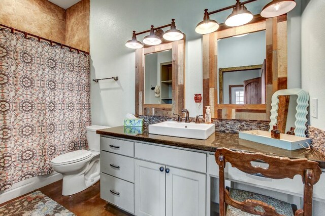 603 Watterson Rd Unit B, Bastrop, TX 78602 - bathroom featuring toilet, vanity, and shower / bath combo with shower curtain