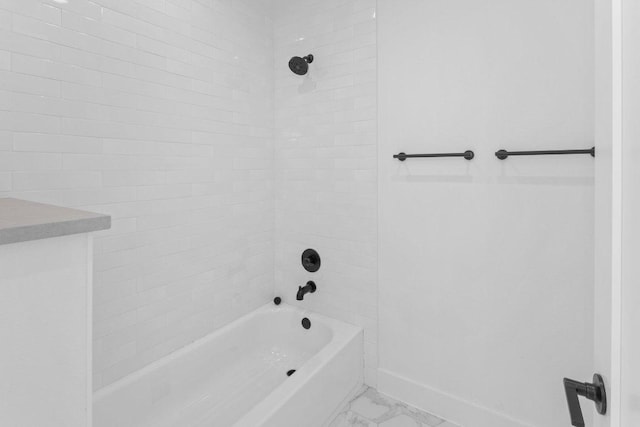 19634 Thurman Bend Rd, Spicewood, TX 78669 - full bathroom featuring marble look tiles and  shower combination