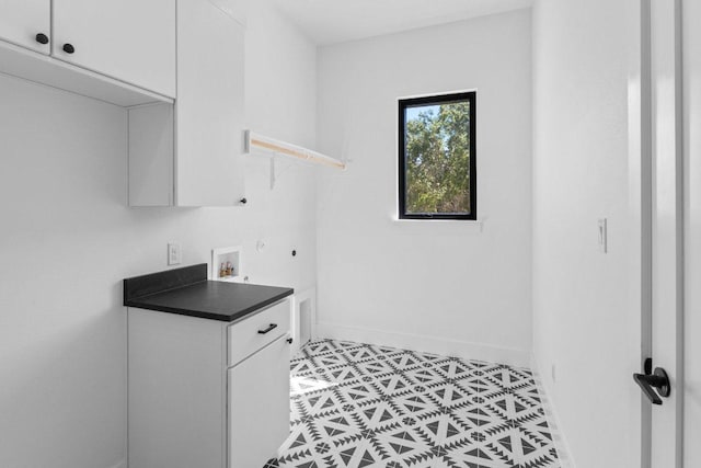 19634 Thurman Bend Rd, Spicewood, TX 78669 - laundry room featuring cabinet space, hookup for a washing machine, and hookup for a gas dryer