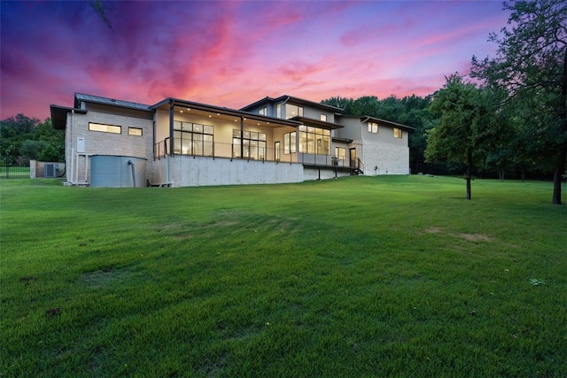 302 Bent Tree Ct, West Lake Hills, TX 78746 - back of property featuring a yard, stone siding, and a balcony