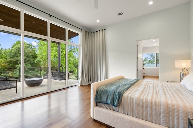 302 Bent Tree Ct, West Lake Hills, TX 78746 - bedroom with access to outside, wood finished floors, recessed lighting, view of wooded area, and ceiling fan