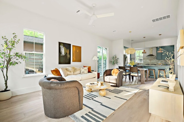 1406 Cometa St Unit 1, Austin, TX 78721 - living area featuring light wood-type flooring, a ceiling fan, and baseboards