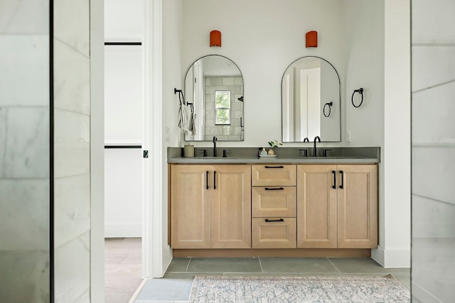 1406 Cometa St Unit 1, Austin, TX 78721 - bathroom featuring tile patterned flooring and double vanity