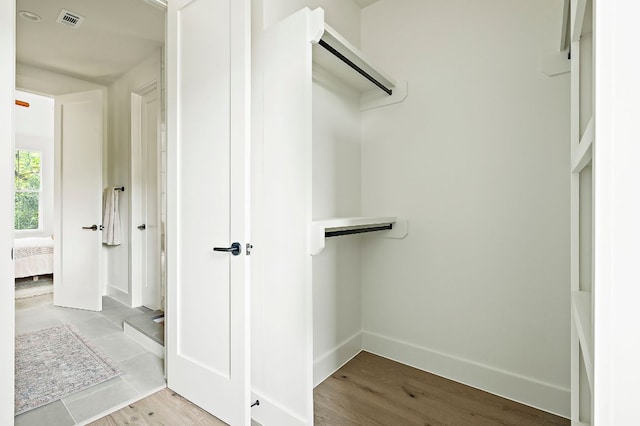 1406 Cometa St Unit 1, Austin, TX 78721 - spacious closet with wood finished floors