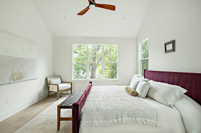 1406 Cometa St Unit 1, Austin, TX 78721 - bedroom featuring wood finished floors, baseboards, a ceiling fan, and high vaulted ceiling