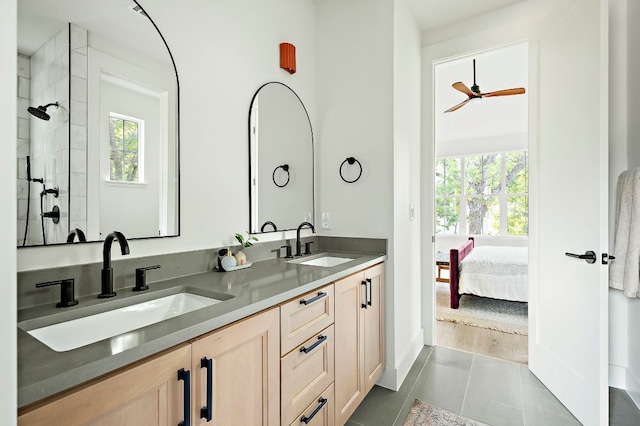 1406 Cometa St Unit 1, Austin, TX 78721 - ensuite bathroom with a tile shower, double vanity, and tile patterned floors