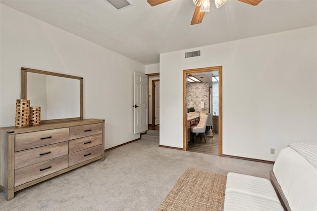 2821 Creek Side Dr, Temple, TX 76502 - bedroom with light colored carpet, baseboards, a ceiling fan, and connected bathroom