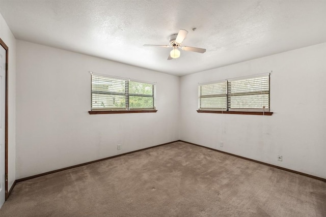 2821 Creek Side Dr, Temple, TX 76502 - spare room with carpet flooring, ceiling fan, baseboards, and a textured ceiling