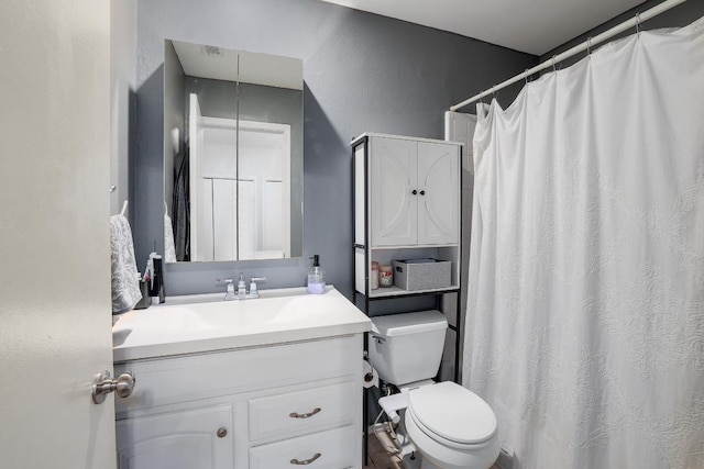 full bathroom featuring toilet, vanity, and curtained shower