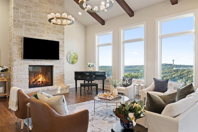 308 Duckhorn Pass, Austin, TX 78738 - living area with wood finished floors, a chandelier, and a stone fireplace