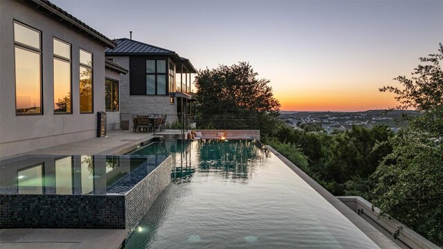 308 Duckhorn Pass, Austin, TX 78738 - view of swimming pool with a pool with connected hot tub and a patio