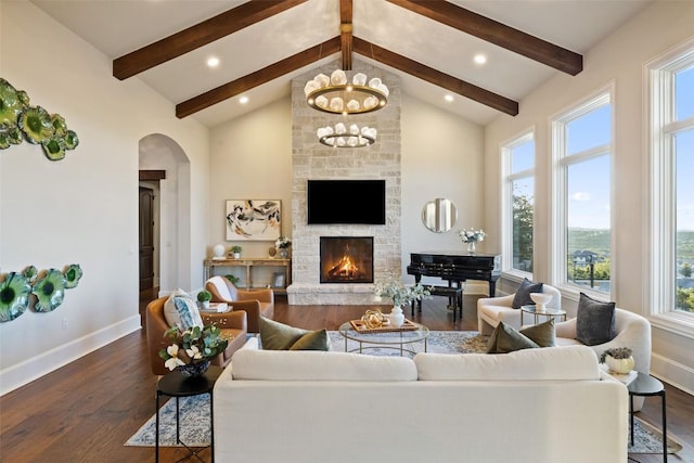 308 Duckhorn Pass, Austin, TX 78738 - living area featuring arched walkways, beamed ceiling, baseboards, wood finished floors, and a chandelier