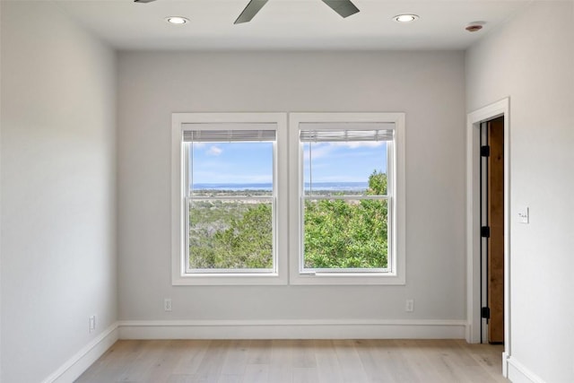 1071 Escalar Dr, Buchanan Dam, TX 78609 - unfurnished room featuring ceiling fan, light wood finished floors, recessed lighting, baseboards, and a smoke detector