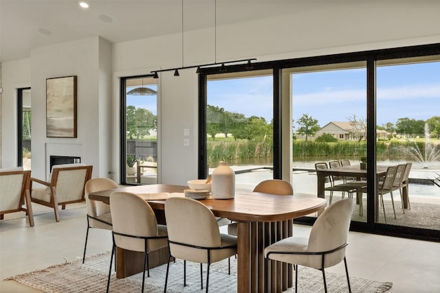 298 Glenview Cir, Belton, TX 76513 - dining area featuring a fireplace, a water view, and recessed lighting