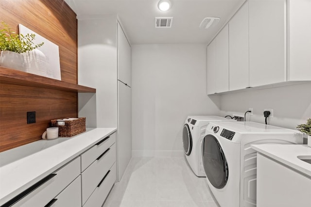 298 Glenview Cir, Belton, TX 76513 - laundry area with cabinet space, separate washer and dryer, and baseboards