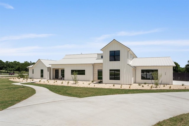 298 Glenview Cir, Belton, TX 76513 - modern inspired farmhouse with board and batten siding, metal roof, and a front yard
