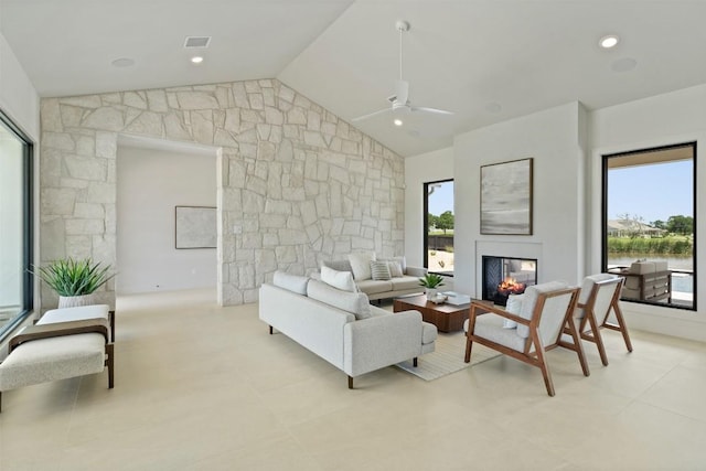 298 Glenview Cir, Belton, TX 76513 - living room with a multi sided fireplace, a ceiling fan, and lofted ceiling