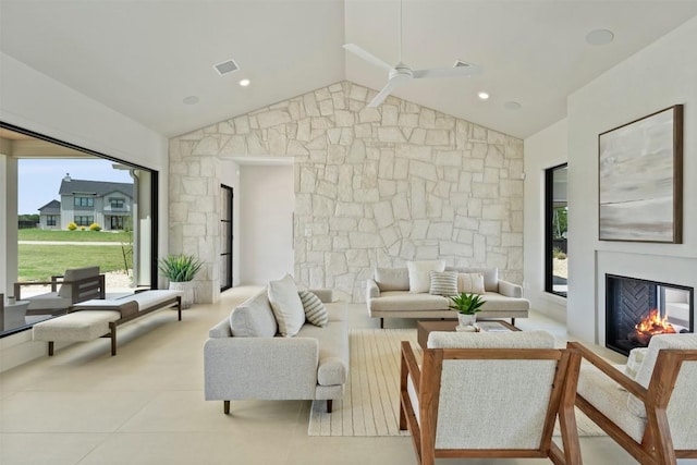 298 Glenview Cir, Belton, TX 76513 - living room featuring a glass covered fireplace, ceiling fan, healthy amount of natural light, and vaulted ceiling