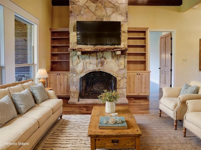 123 County Rd, Paige, TX 78659 - living room with wood finished floors and a fireplace