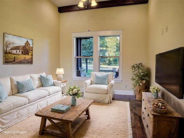 123 County Rd, Paige, TX 78659 - living room with dark wood-style flooring, a towering ceiling, baseboards, and beam ceiling