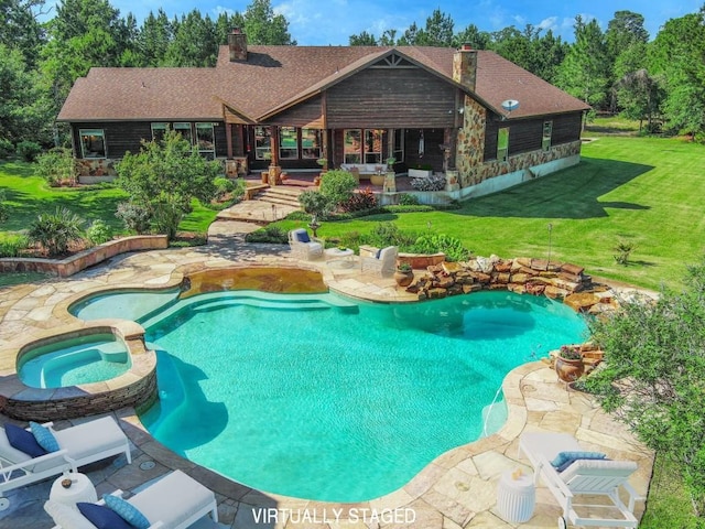 123 County Rd, Paige, TX 78659 - view of swimming pool featuring a yard, a patio area, and a pool with connected hot tub
