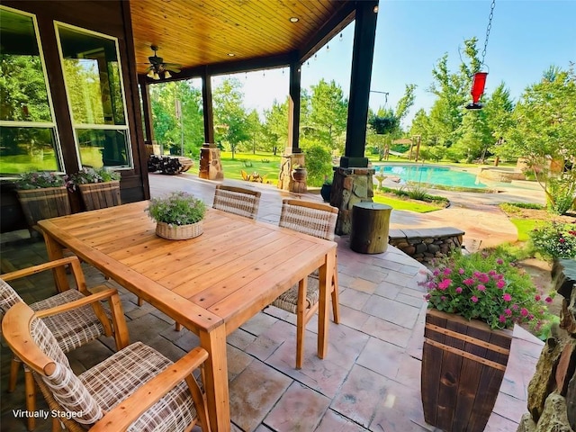 123 County Rd, Paige, TX 78659 - view of patio / terrace featuring an outdoor pool, a ceiling fan, and outdoor dining area
