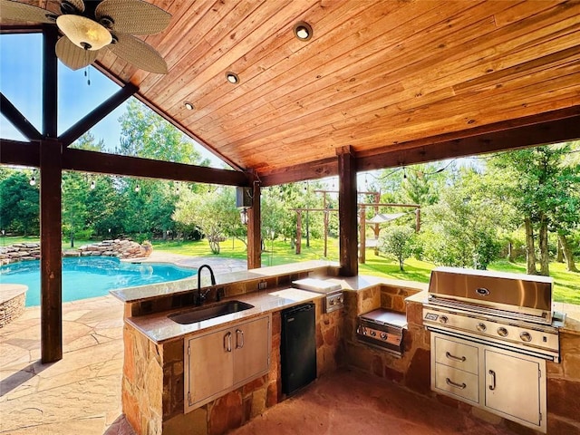 123 County Rd, Paige, TX 78659 - view of patio with a sink, area for grilling, and ceiling fan