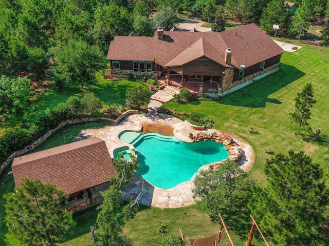 123 County Rd, Paige, TX 78659 - swimming pool featuring a lawn and a patio area