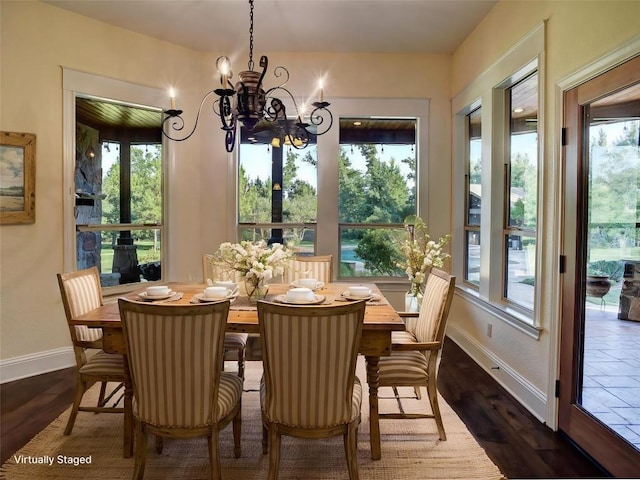 123 County Rd, Paige, TX 78659 - dining room with baseboards, a chandelier, and dark wood-type flooring