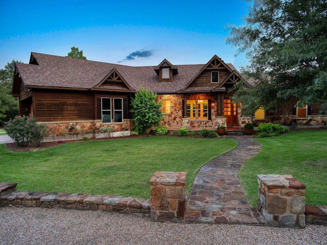 123 County Rd, Paige, TX 78659 - view of front facade featuring stone siding, covered porch, a front yard, and roof with shingles