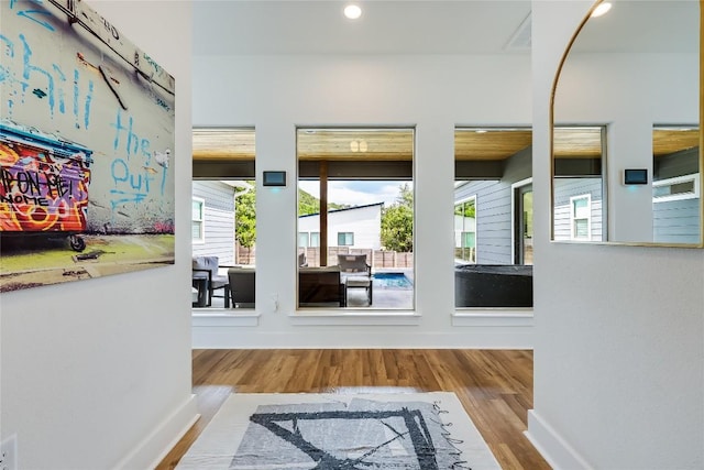 8603 Big Horn Cir, Lago Vista, TX 78645 - doorway with wood finished floors and recessed lighting