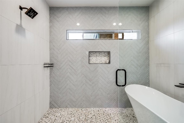 8603 Big Horn Cir, Lago Vista, TX 78645 - bathroom featuring a freestanding bath and tiled shower