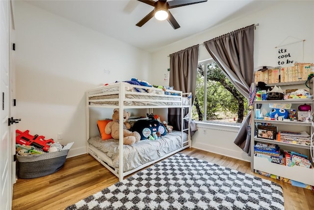 8603 Big Horn Cir, Lago Vista, TX 78645 - bedroom featuring wood finished floors and ceiling fan