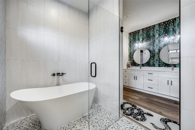 8603 Big Horn Cir, Lago Vista, TX 78645 - full bathroom with tile walls, a freestanding bath, and double vanity