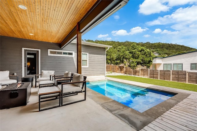 8603 Big Horn Cir, Lago Vista, TX 78645 - view of pool featuring a patio area, a fenced backyard, and an outdoor living space with a fire pit