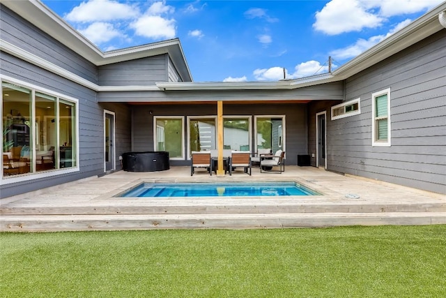 8603 Big Horn Cir, Lago Vista, TX 78645 - rear view of property with a wooden deck, an outdoor pool, and a lawn