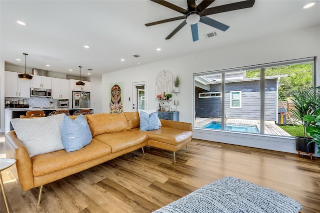 8603 Big Horn Cir, Lago Vista, TX 78645 - living area with ceiling fan, light wood-style flooring, and recessed lighting