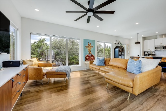 8603 Big Horn Cir, Lago Vista, TX 78645 - living room with a ceiling fan, wood finished floors, and recessed lighting