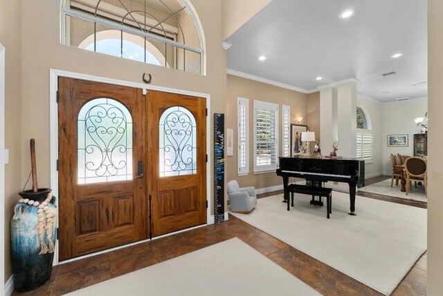 9201 Silver Pine Cv, Austin, TX 78733 - foyer entrance with crown molding, recessed lighting, and baseboards