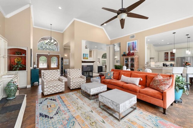 9201 Silver Pine Cv, Austin, TX 78733 - living room featuring a ceiling fan, crown molding, high vaulted ceiling, and baseboards