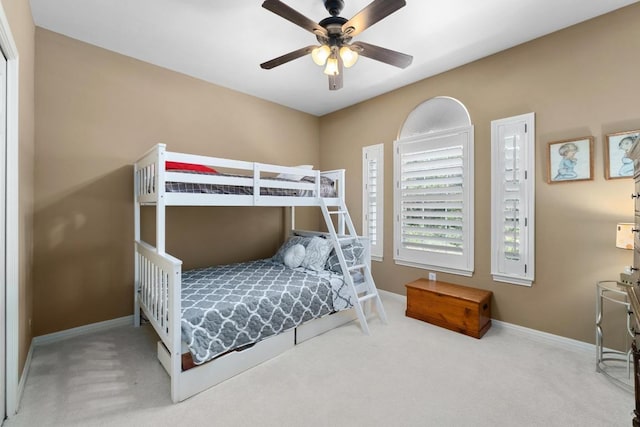 9201 Silver Pine Cv, Austin, TX 78733 - carpeted bedroom with baseboards and a ceiling fan