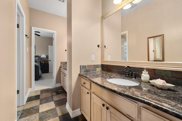 9201 Silver Pine Cv, Austin, TX 78733 - ensuite bathroom featuring vanity and baseboards