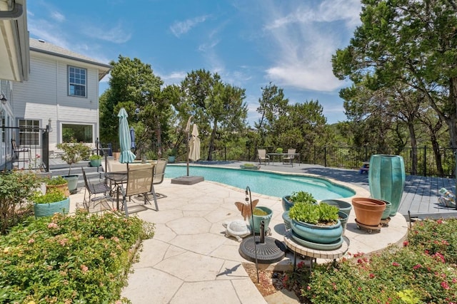 9201 Silver Pine Cv, Austin, TX 78733 - view of swimming pool featuring fence, a patio, and view of wooded area