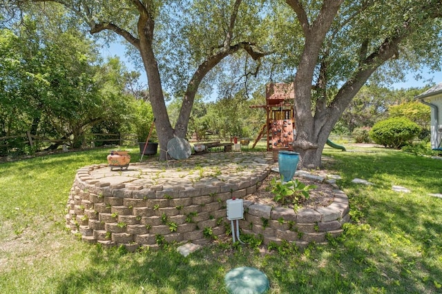 9201 Silver Pine Cv, Austin, TX 78733 - view of grassy yard with a playground