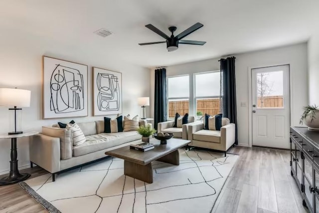 living area featuring ceiling fan and light wood-style flooring